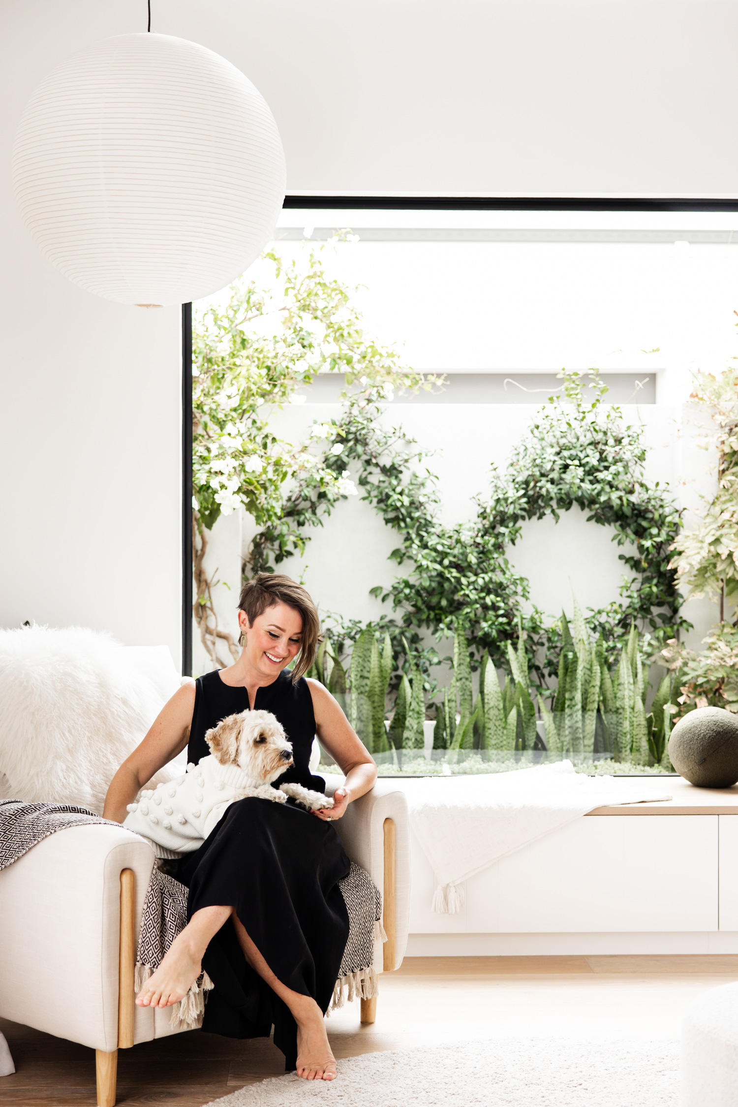 Perth Interior Designer, Ainslie, with Alfie in beautifully designed living room